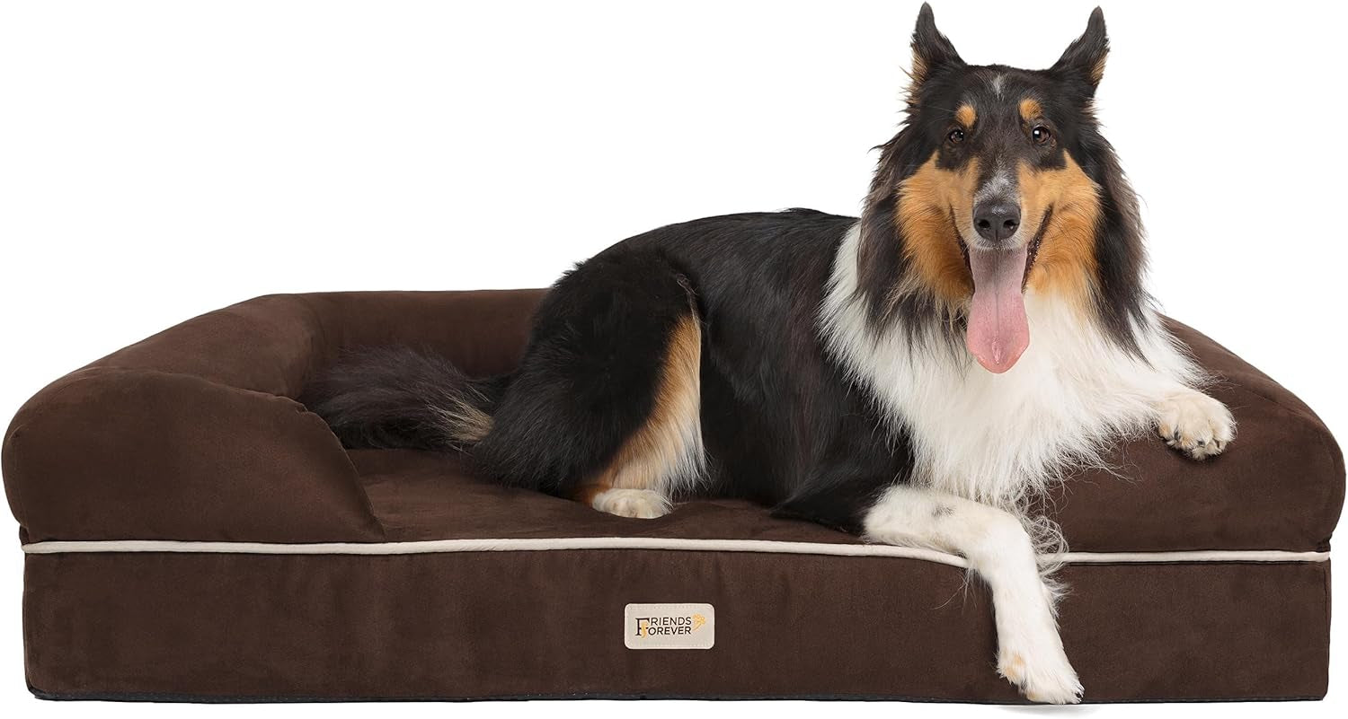 Side profile of a dark brown bolster dog couch with a long-coated black and tan collie reclining and front paw over the edge.