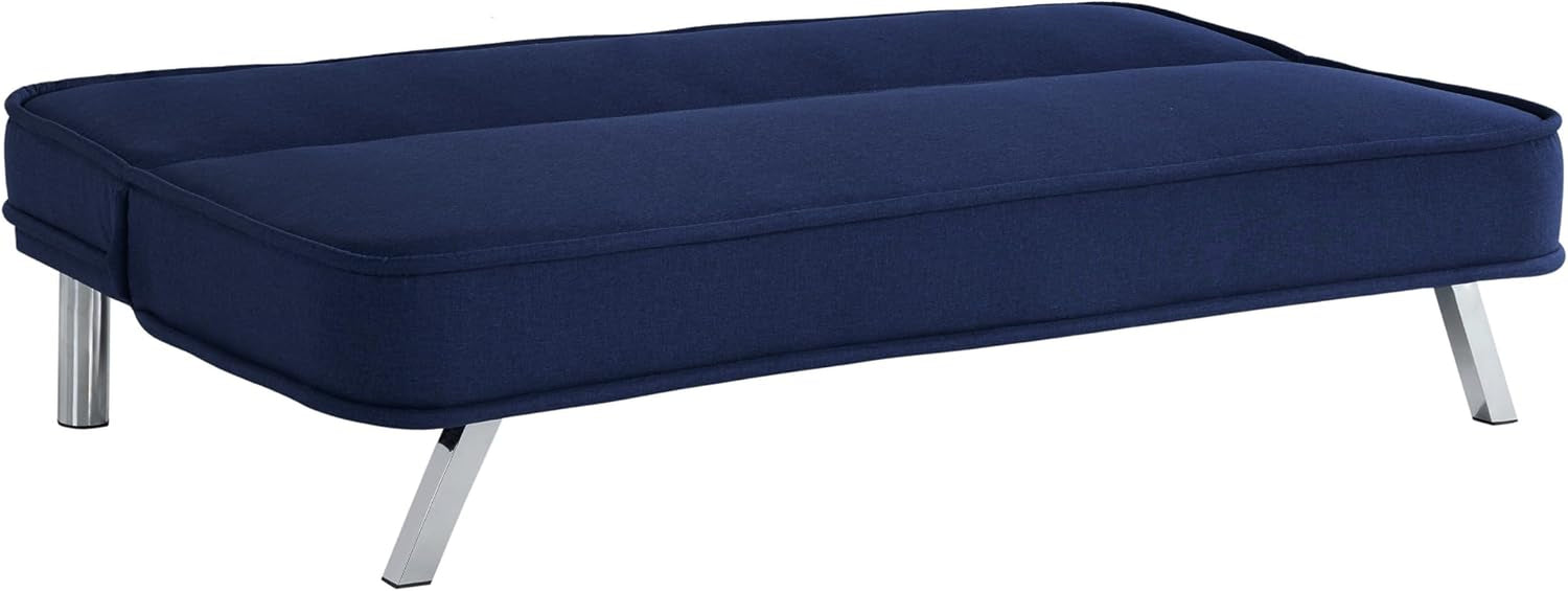 Navy futon converted flat to sleeper showing mattress-like cushion and chrome legs.