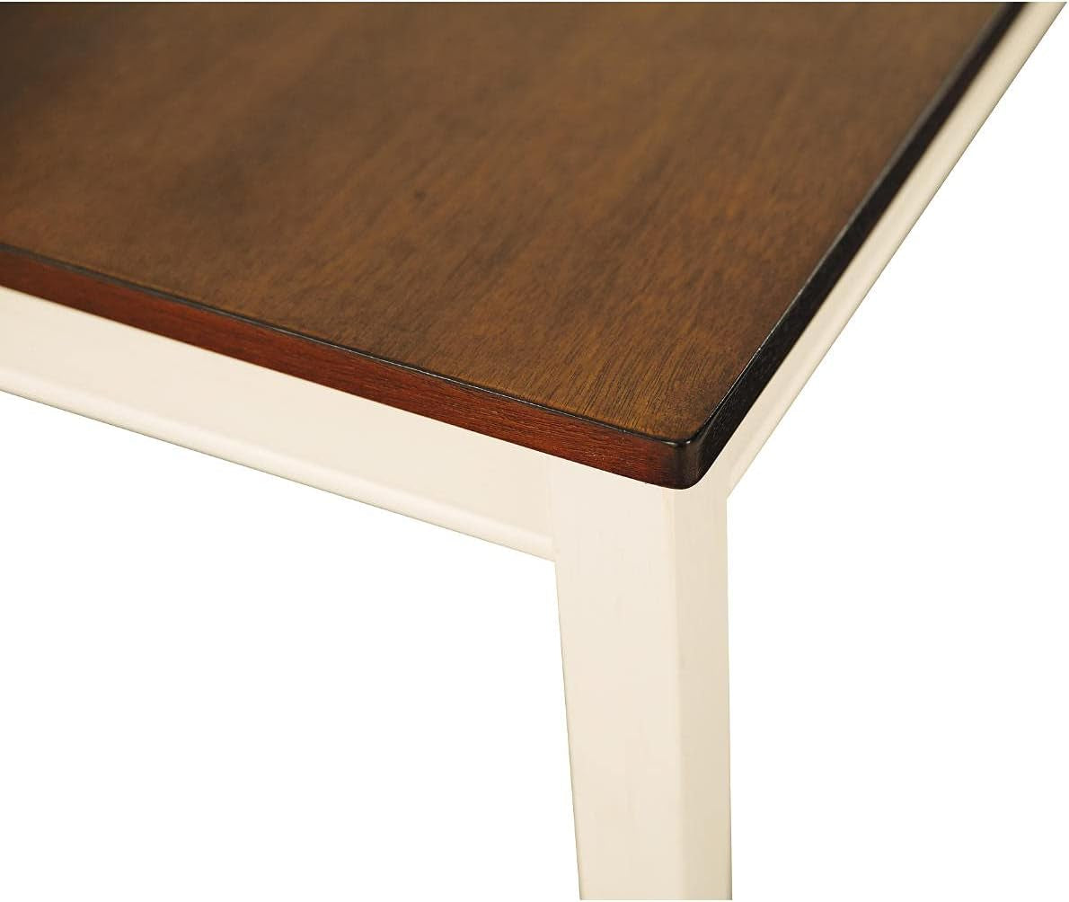 Close-up of the bench corner highlighting the dark wood grain top and cream-painted apron