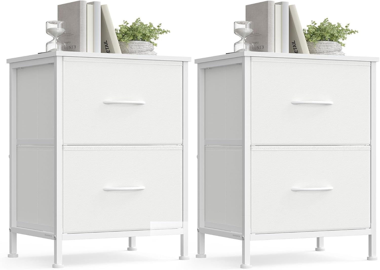 Two identical white bedside chests side by side with books and plant on top