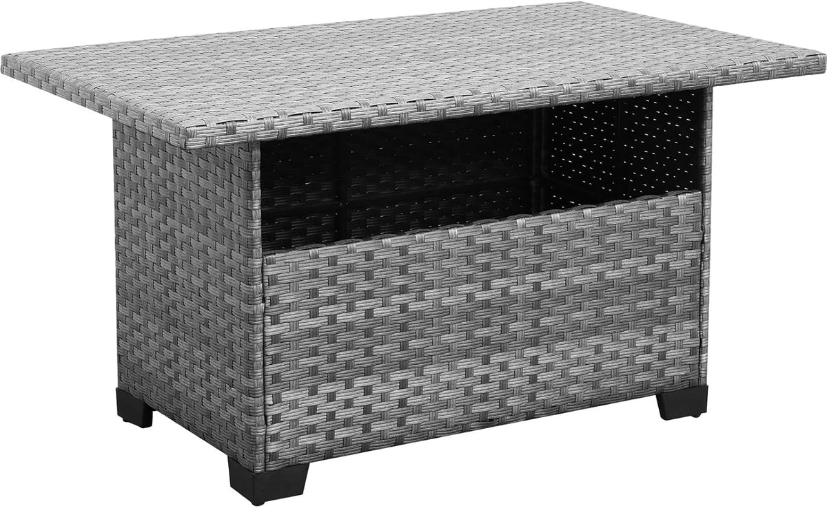 Low-angle three-quarter view highlighting the table's raised tabletop edge, textured wicker sides, and corner foot.