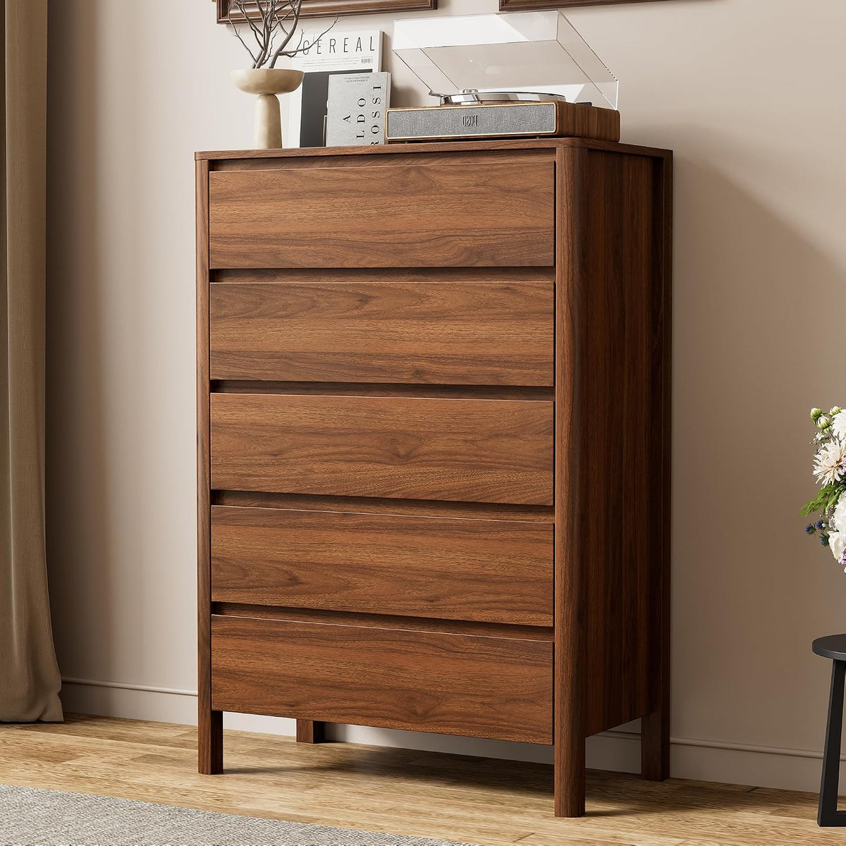 Walnut finish tall 5-drawer dresser front view in a staged bedroom setting, angled slightly to the left