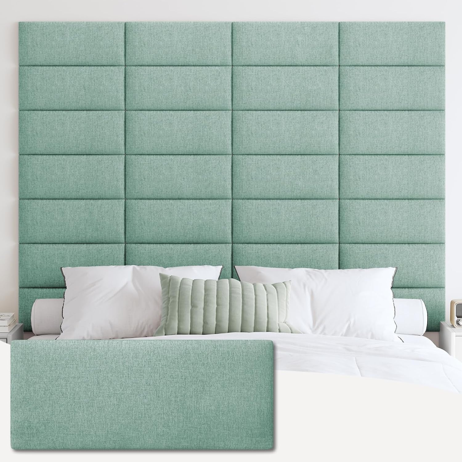 Mint-green tufted panel headboard covering wall behind a bed with white bedding and a ribbed sage pillow.