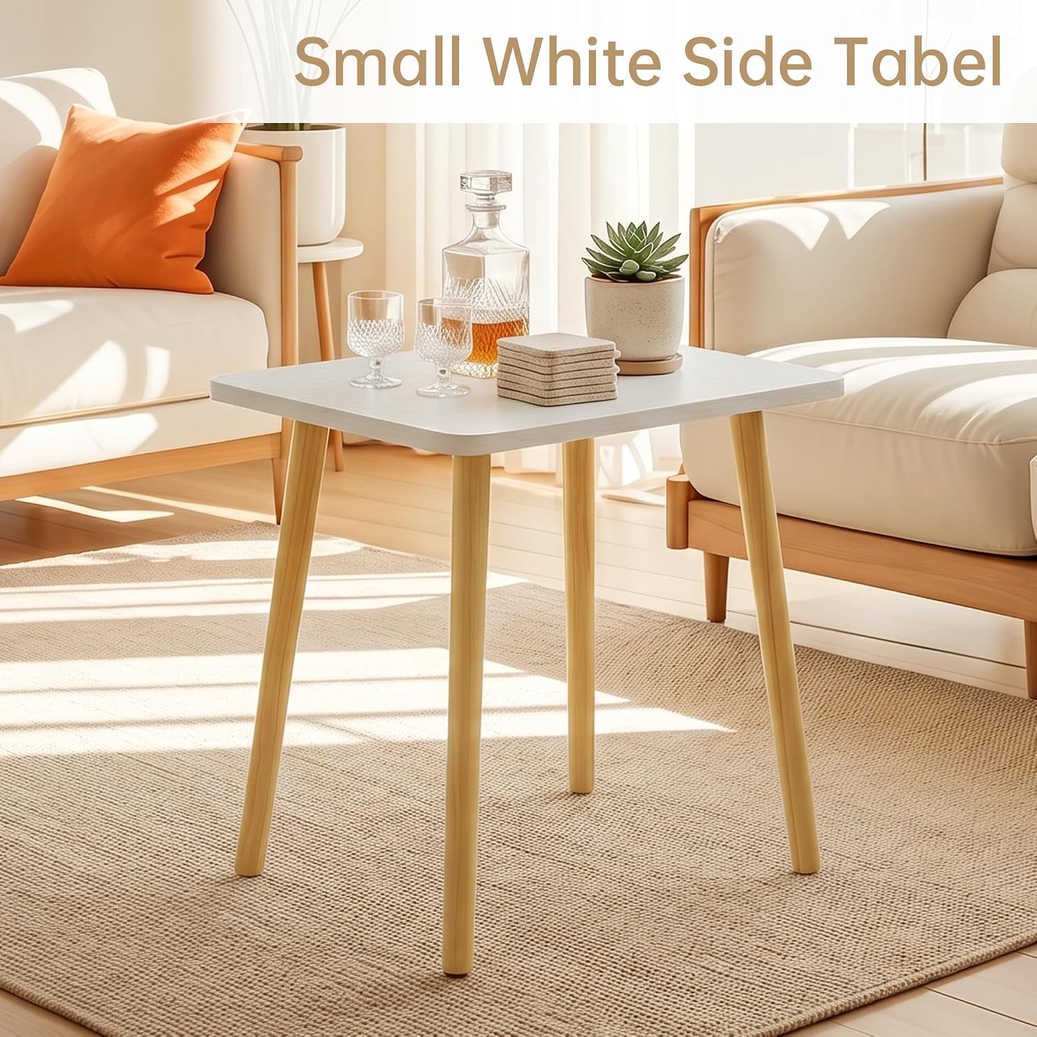 White tabletop side table with four natural wood legs styled between two armchairs in living room