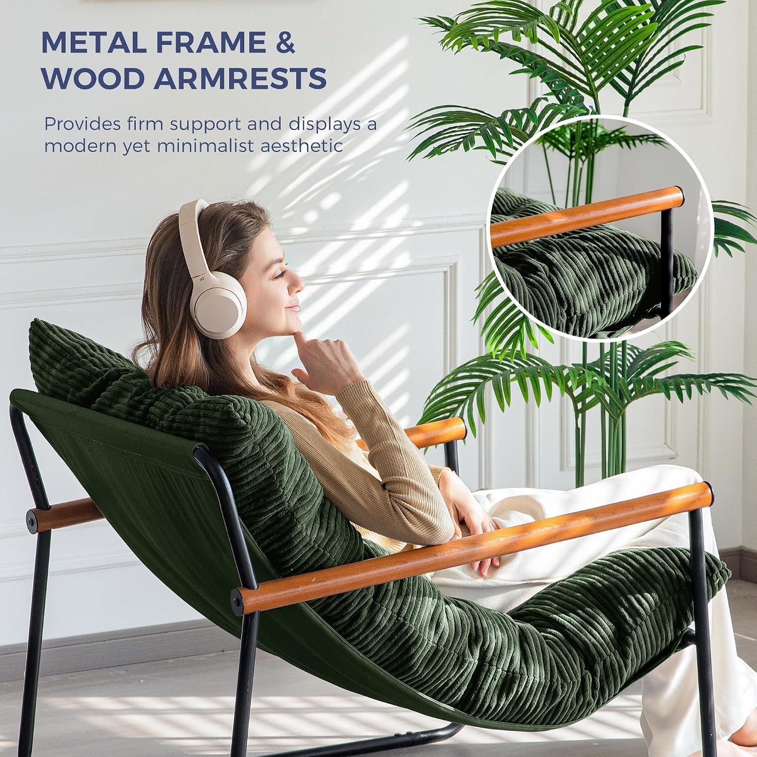 Side view of chair with wooden armrests and a person reclining to show seat profile