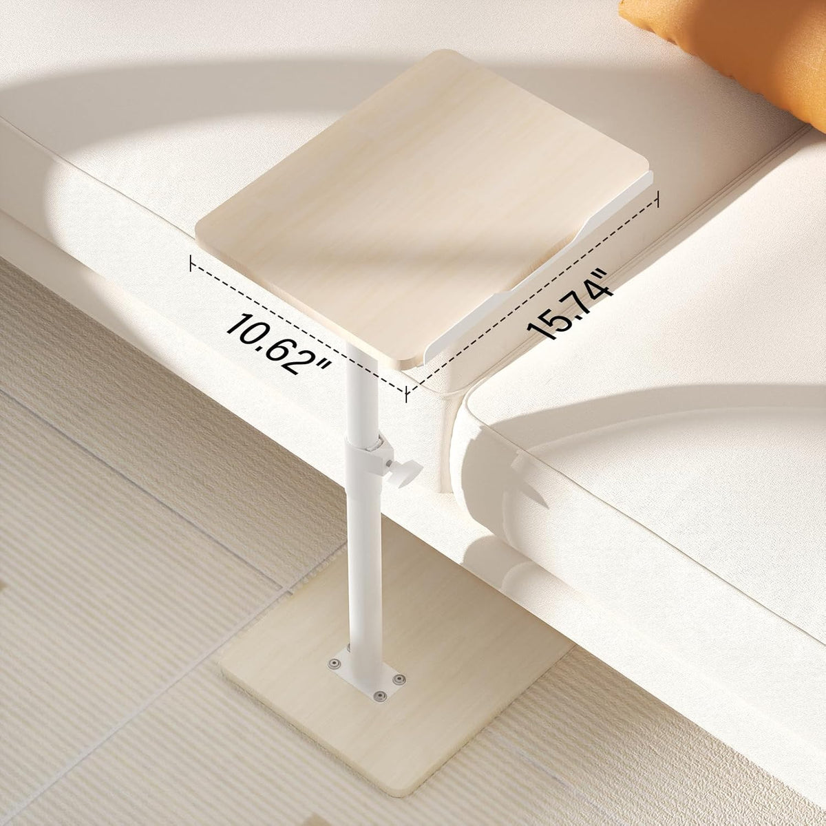 Light wood tabletop with front baffle shown resting on a sofa arm, angled close-up view
