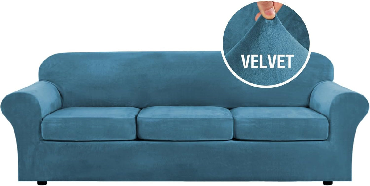 Full front shot of a teal three-cushion sofa in velvet highlighting three separate seat cushions and rounded arms.
