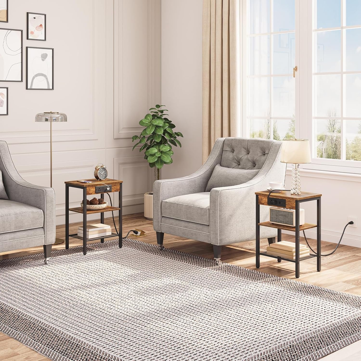 Pair of rustic brown side tables beside gray armchairs in a living room setting