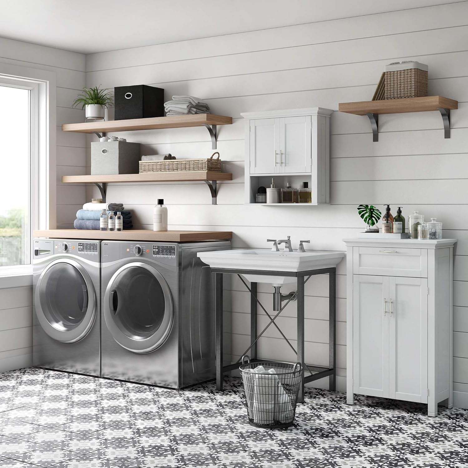 Laundry room scene with a white two-door wall cabinet mounted above a sink and an open shelf below