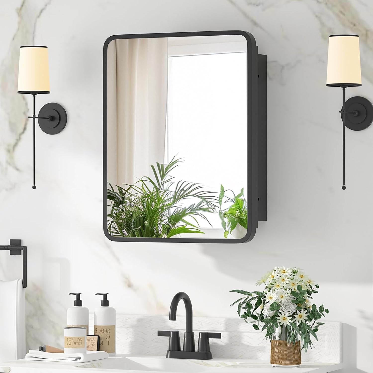 Wall-mounted single mirrored medicine cabinet with black frame centered over a modern bathroom sink.