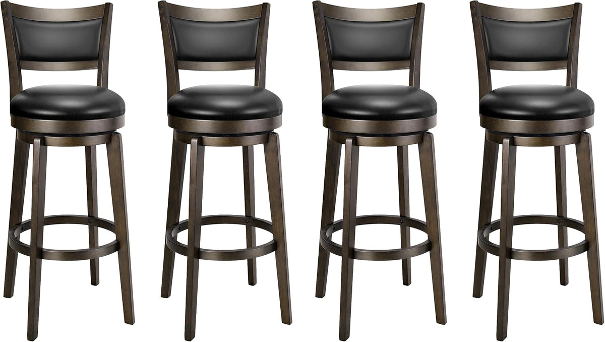 Four bar stools shown slightly angled, round black seats with wrap-around footrest and tapered wood legs.