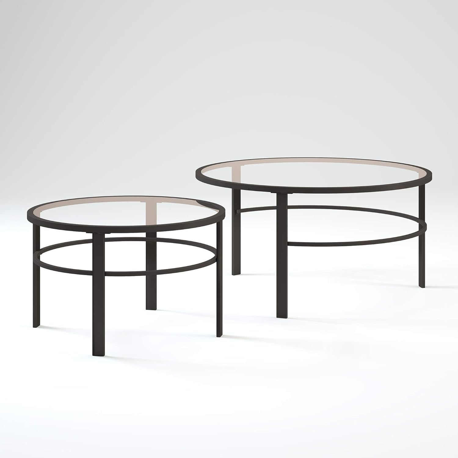 Two nesting round tables isolated on a white background, showing circular lower rings and straight square legs.