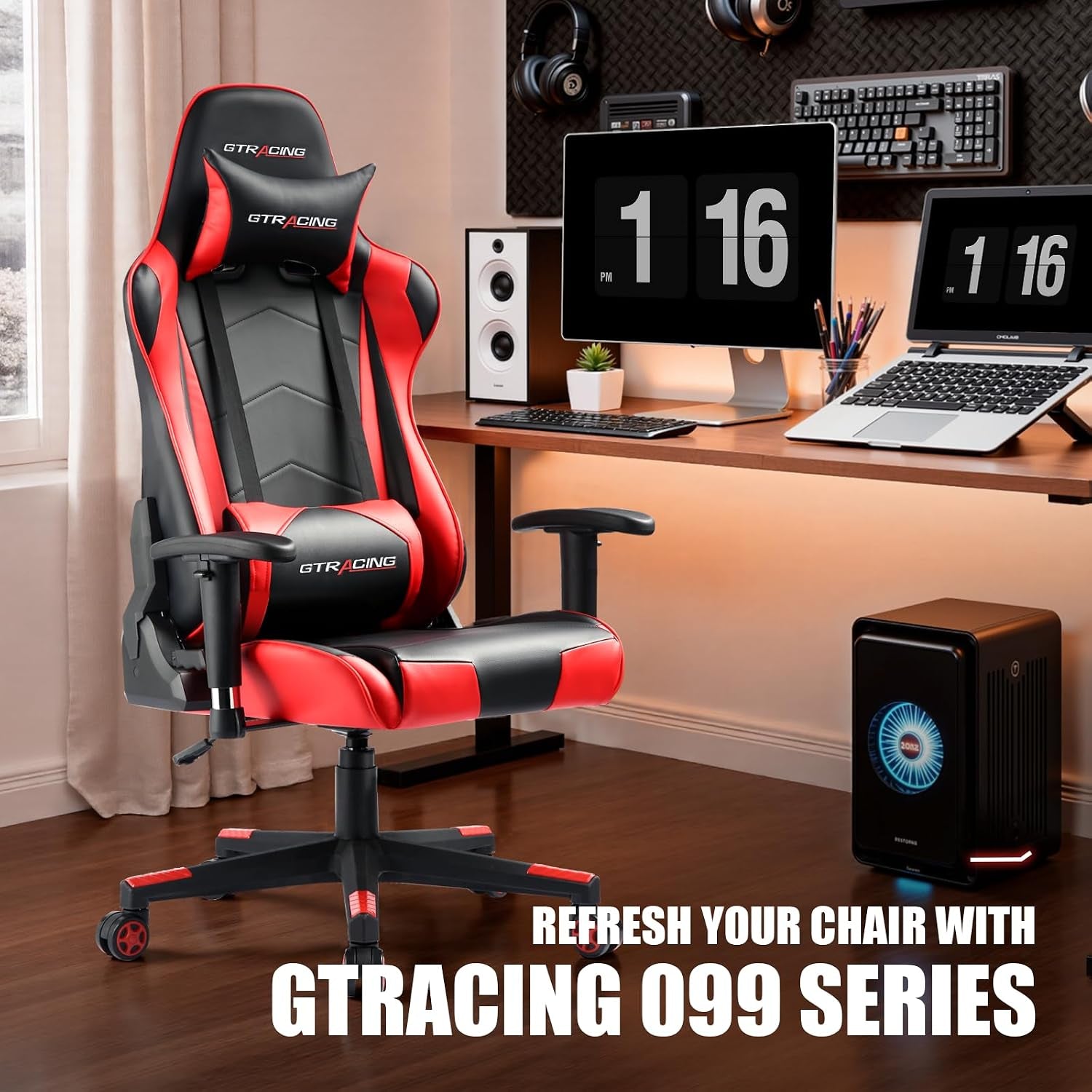 Red and black gaming chair in a desktop gaming setup with monitors and speakers in the background
