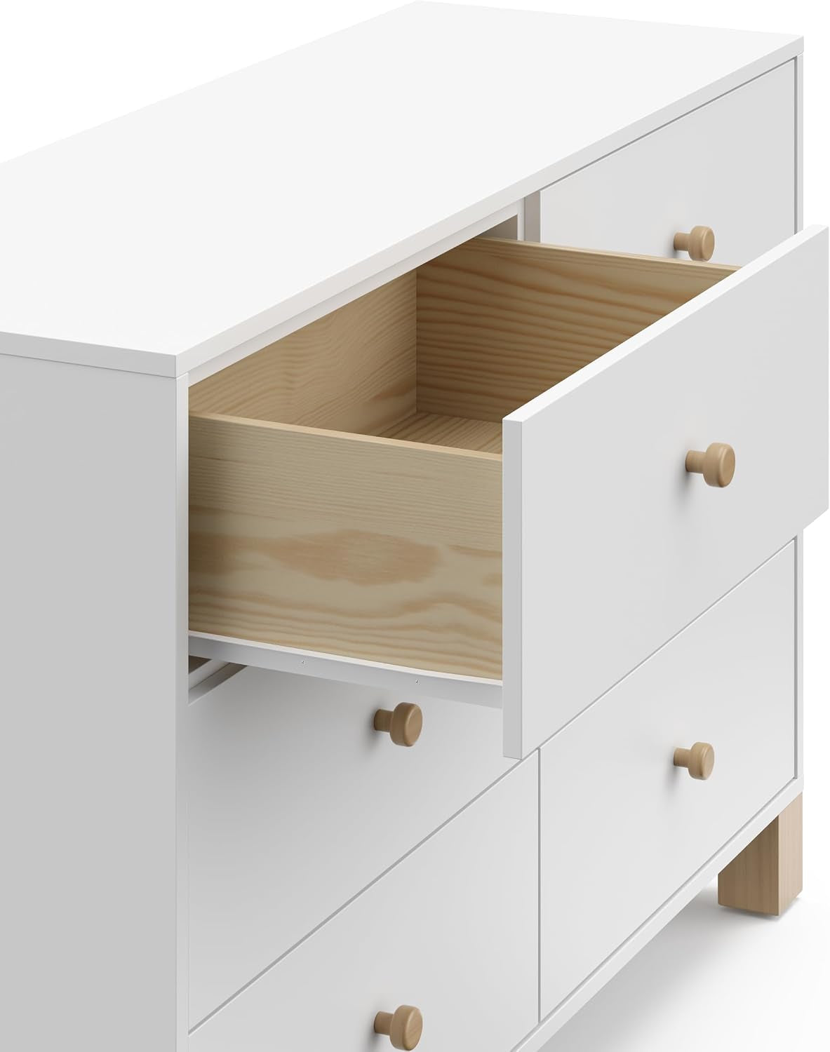 Close-up of one open top drawer showing interior wood finish and white exterior with a light wood knob.