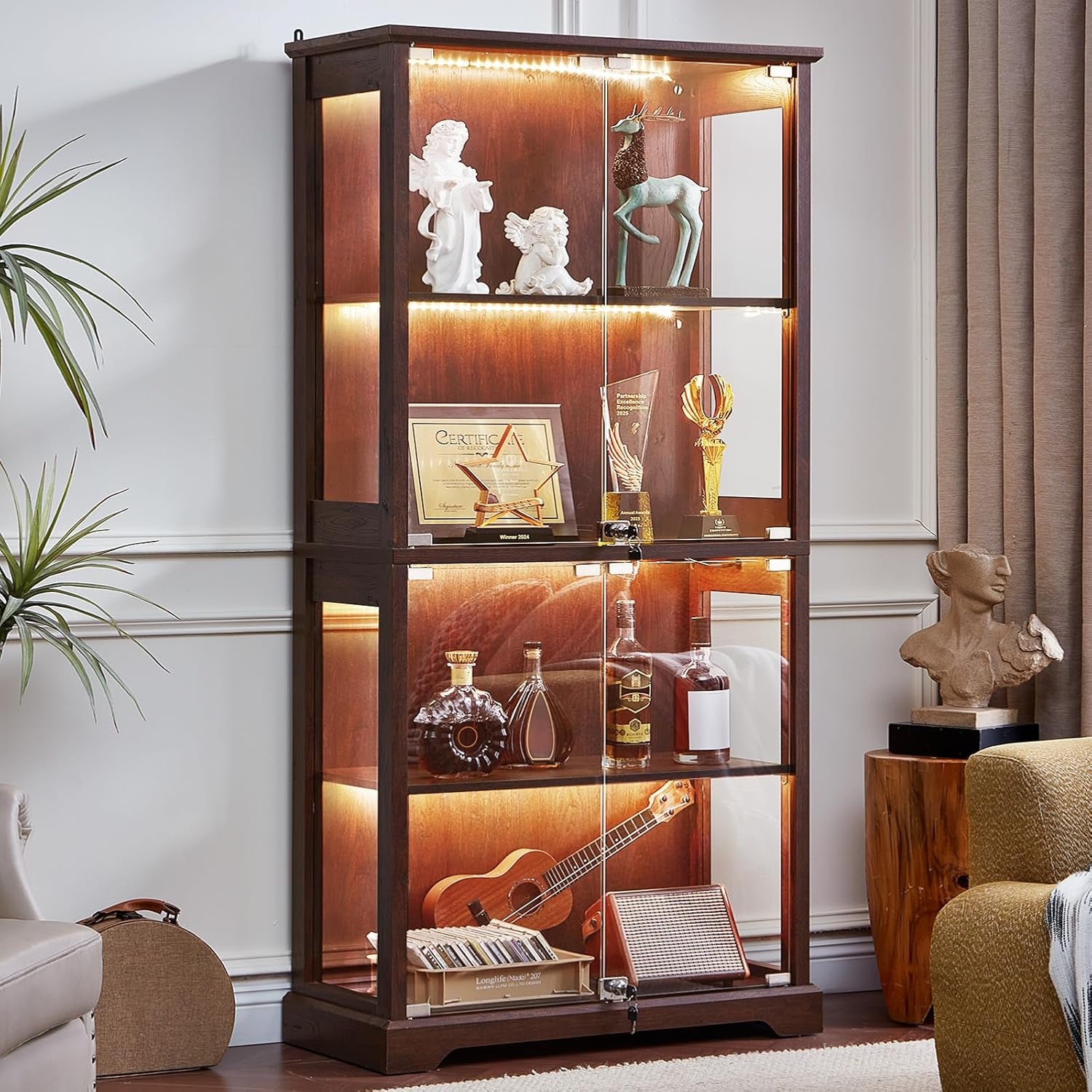 Walnut-finish four-door glass display cabinet lit by warm LEDs, front view in a living room setting