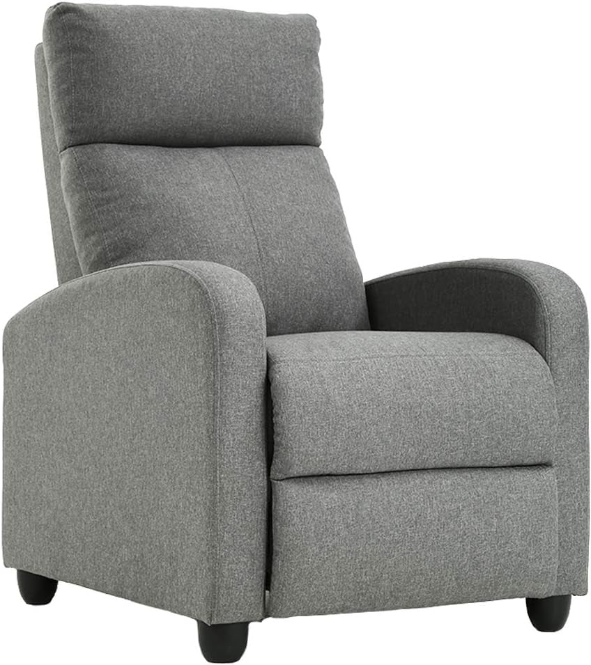 Grey fabric recliner three-quarter view, upright with footrest closed, rounded arms and tall padded headrest.