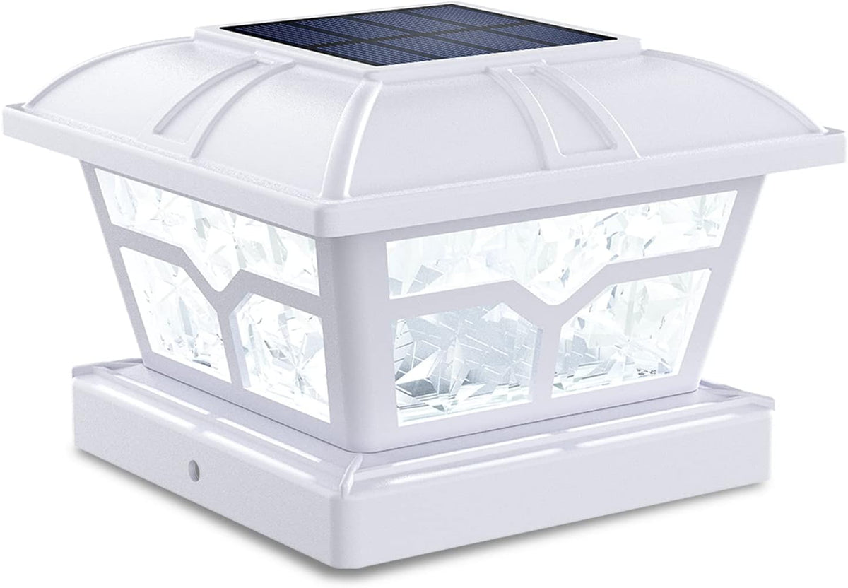 A white post cap light with a solar panel and clear faceted side panels.