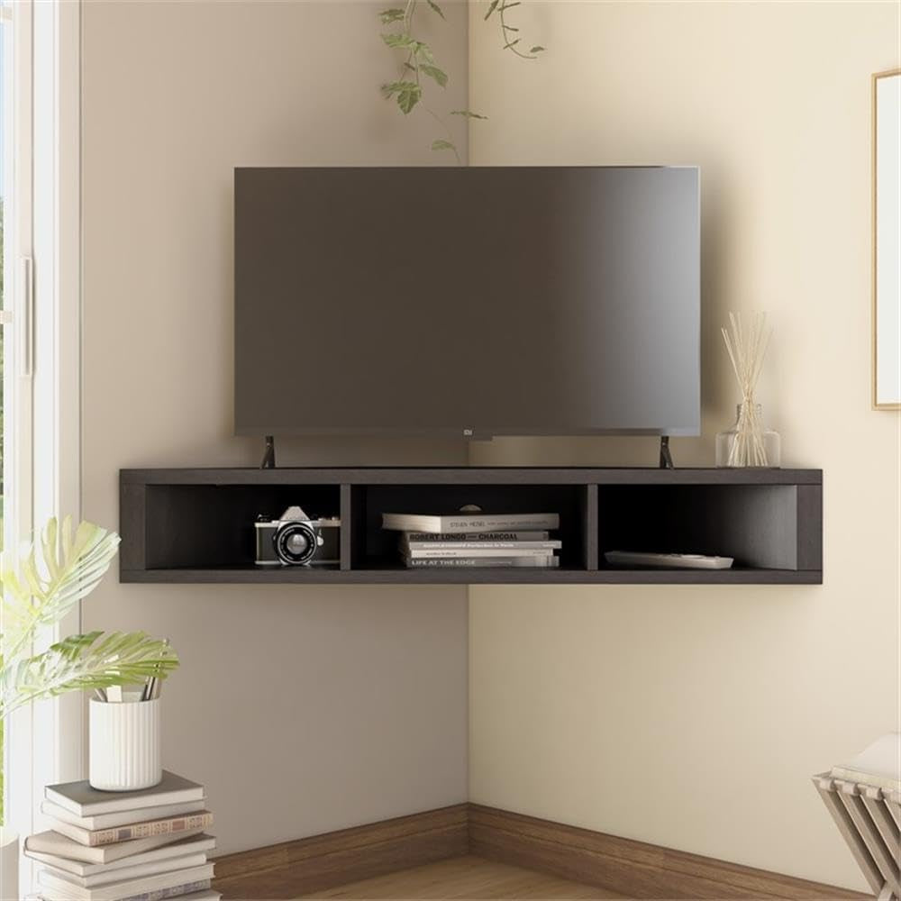 Room view of cappuccino corner floating TV stand under a television with books and decor in the three open shelves