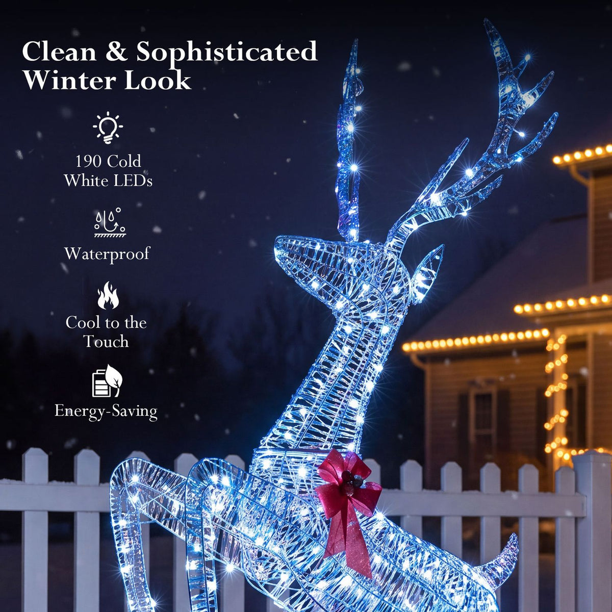 Close view of the illuminated reindeer’s wire frame, branching antlers, and red bow.