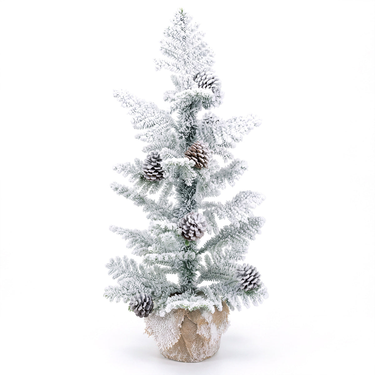 Snow-flocked tabletop tree with pinecones and a burlap-wrapped base against a white background.