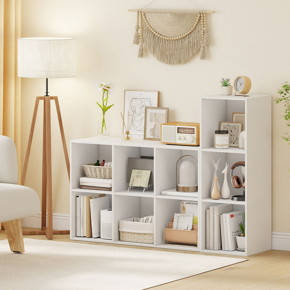 White cube shelves filled with books and decor in a bright living room.