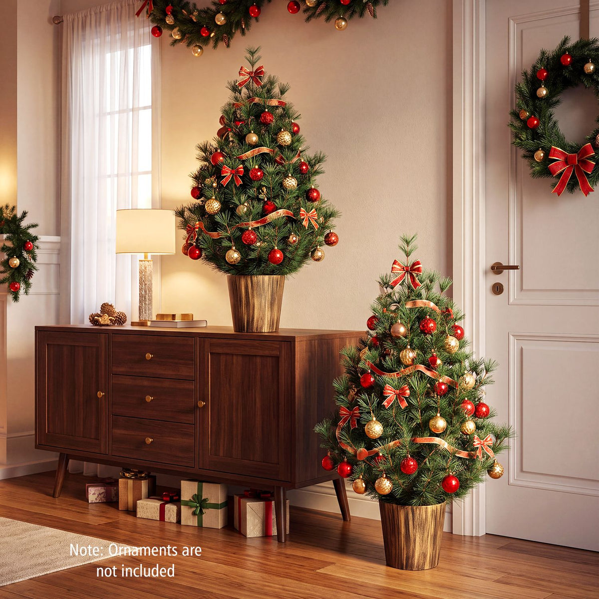 Two decorated potted Christmas trees displayed in a living room
