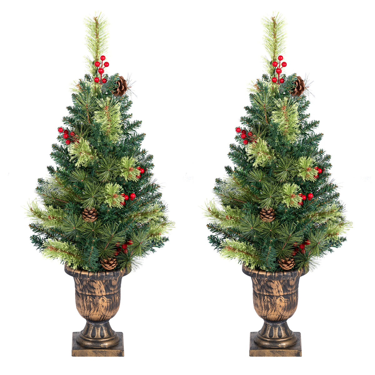 Two unlit tabletop evergreens with red berries and pinecones in matching urn-style planters.