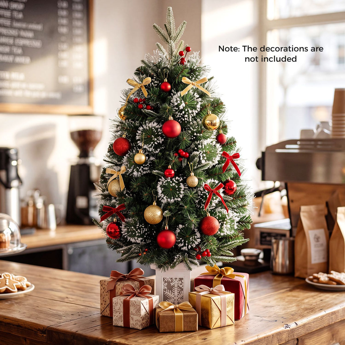 Decorated, snow-dusted Christmas tree on a wooden table, surrounded by wrapped gifts in a bright dining room.