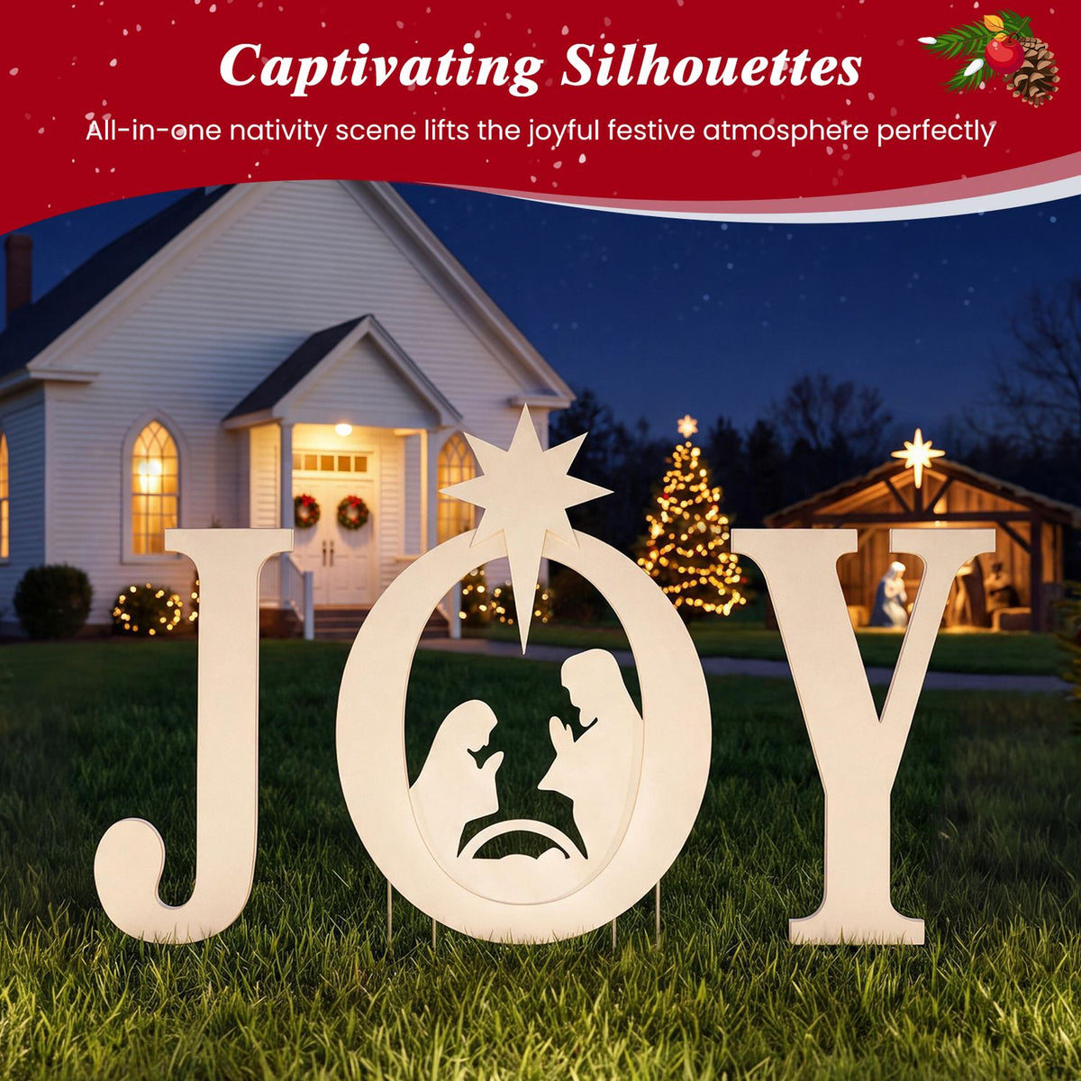 Cream JOY yard sign with a nativity scene and star in a grassy yard at night.