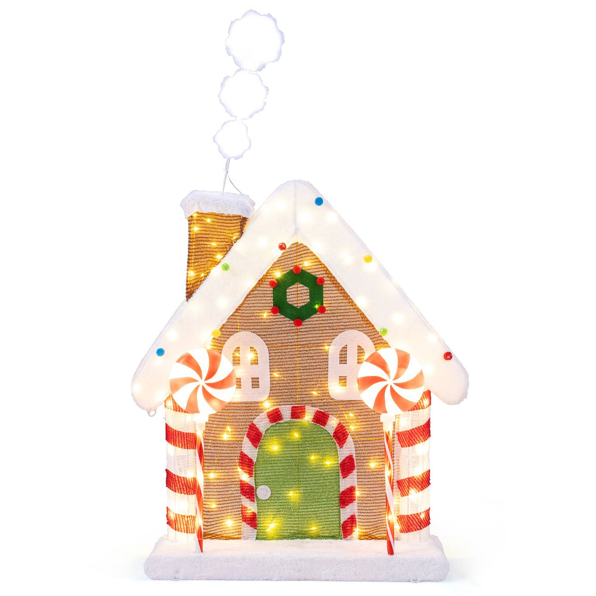 Front view of the illuminated gingerbread house isolated against a white background.