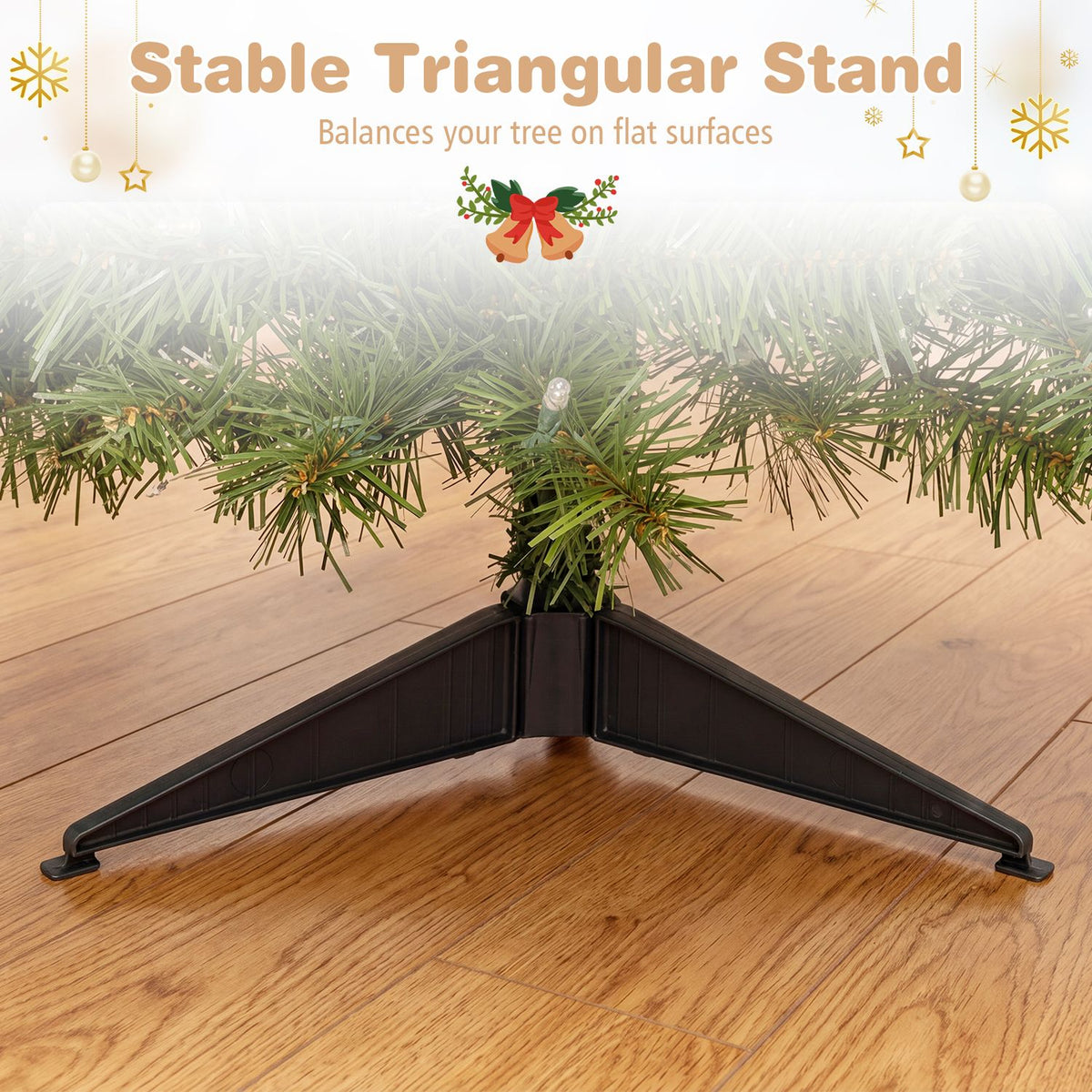 Close view beneath the tree shows its dark triangular stand resting on a wood floor.