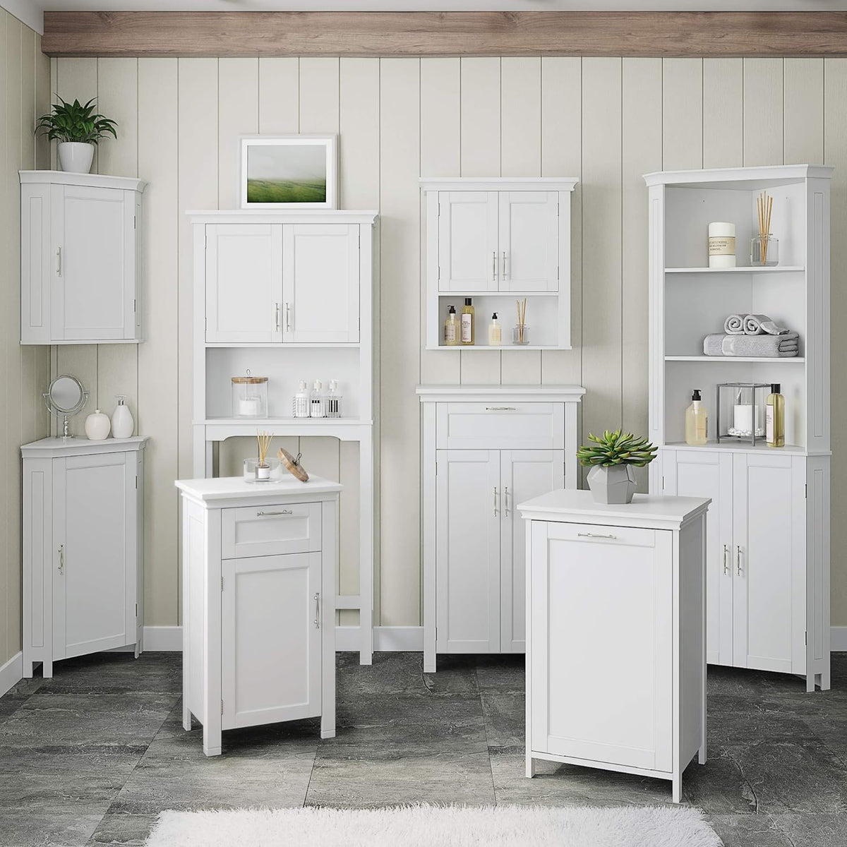 Multiple white storage cabinets arranged along a wall including a centered two-door wall cabinet with open shelf