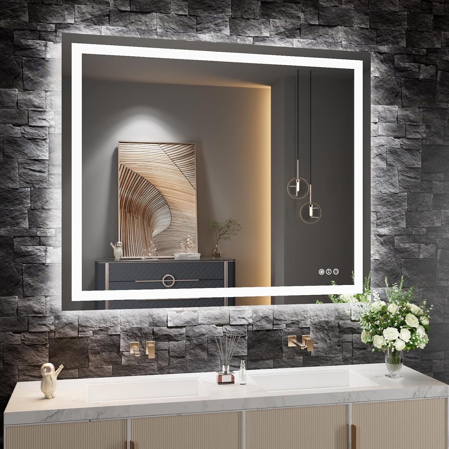 LED mirror with bright inner border and soft backlight over a double vanity set against dark stacked-stone wall.