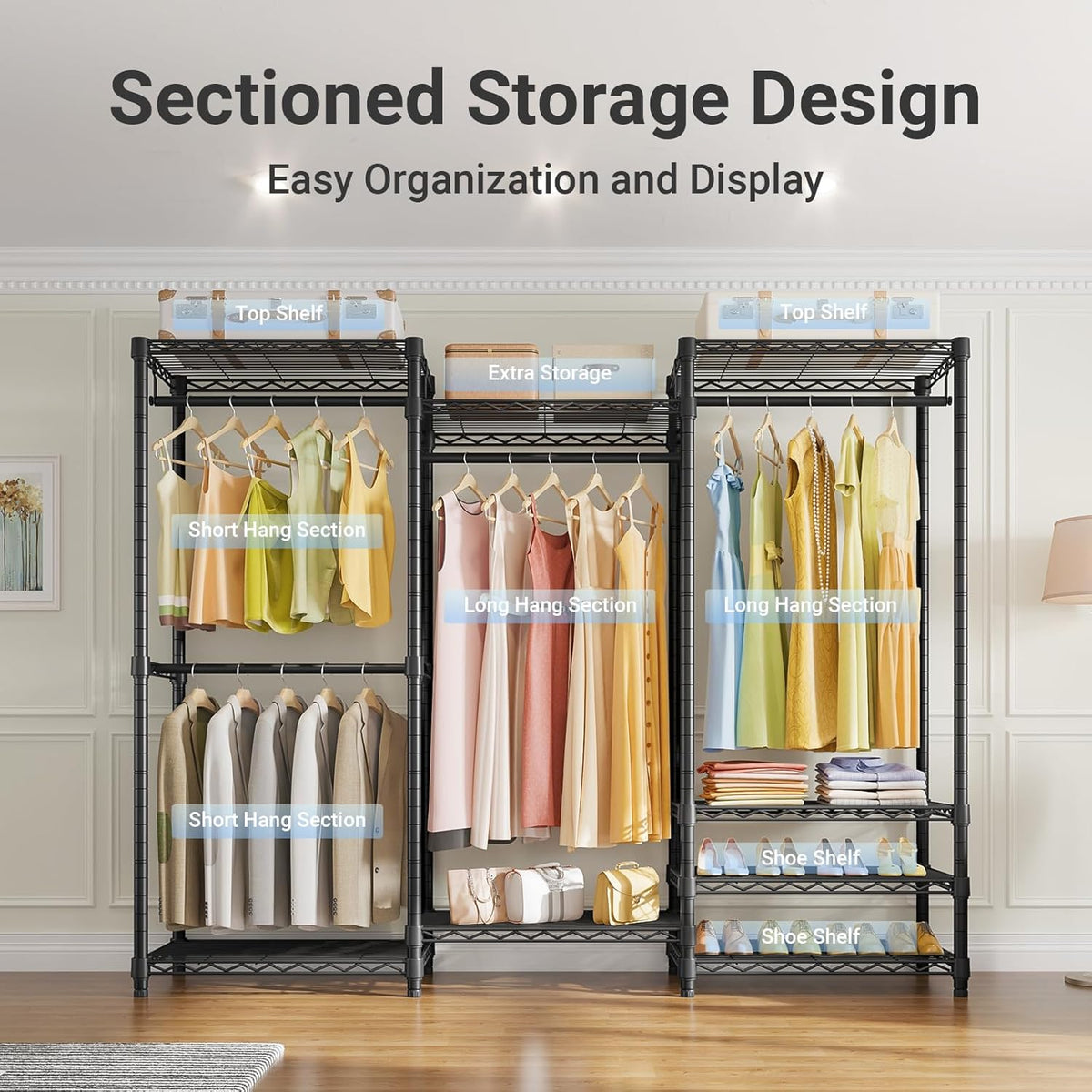 Three-section black metal clothes rack filled with dresses, suits and shoes in a styled room.
