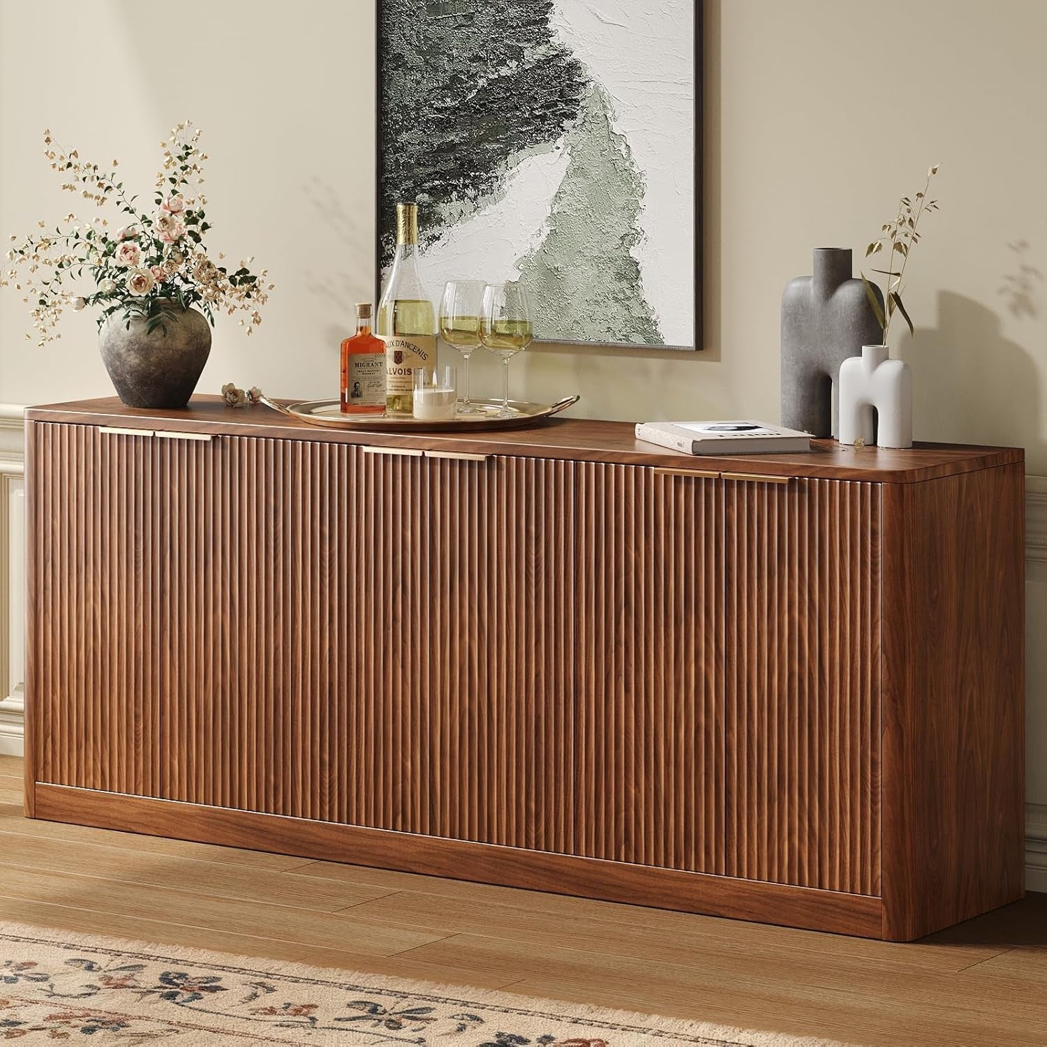 Walnut fluted six-door sideboard angled front view with tray, vase, and artwork above