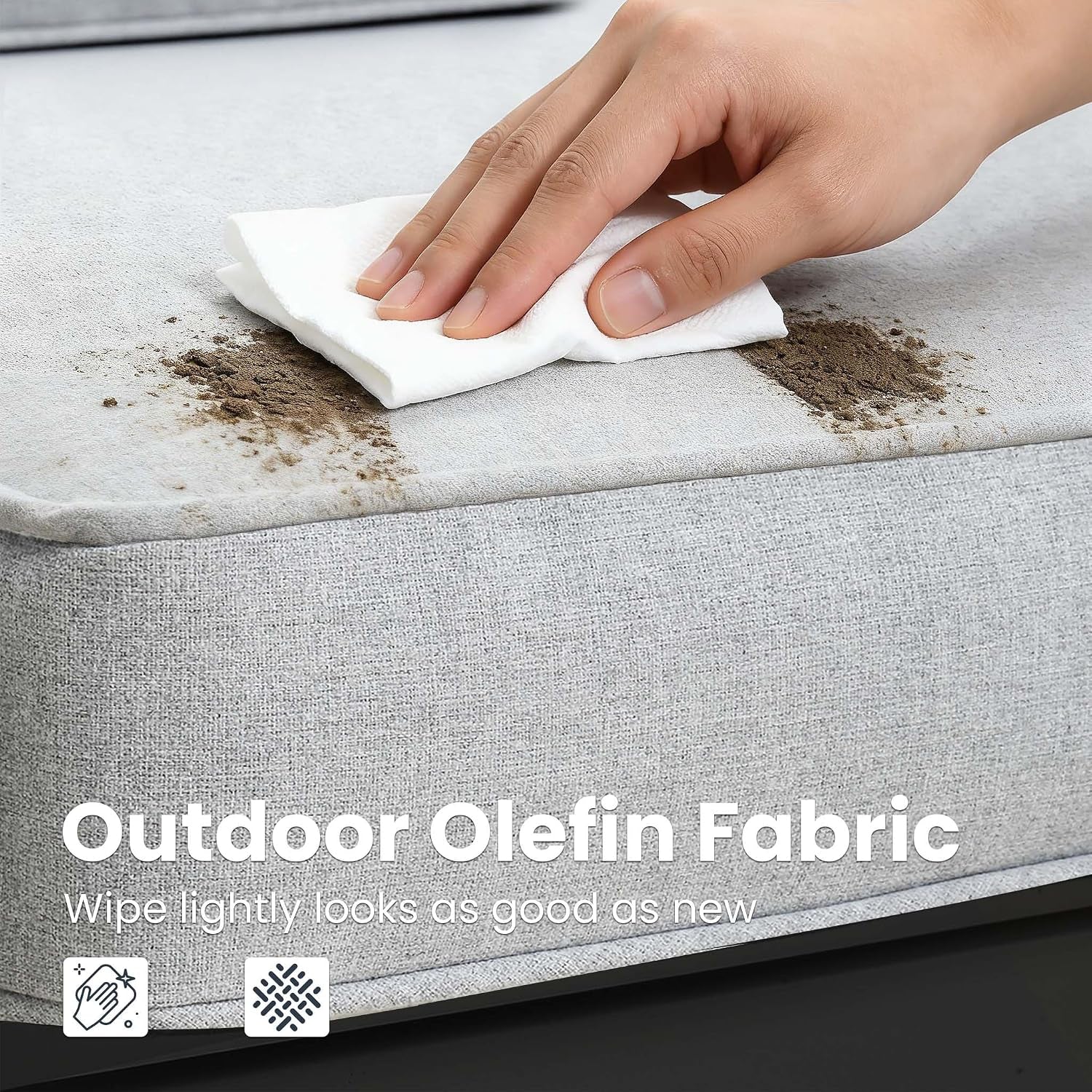 Close view of light grey Olefin cushion being wiped clean to show wipeable upholstery texture