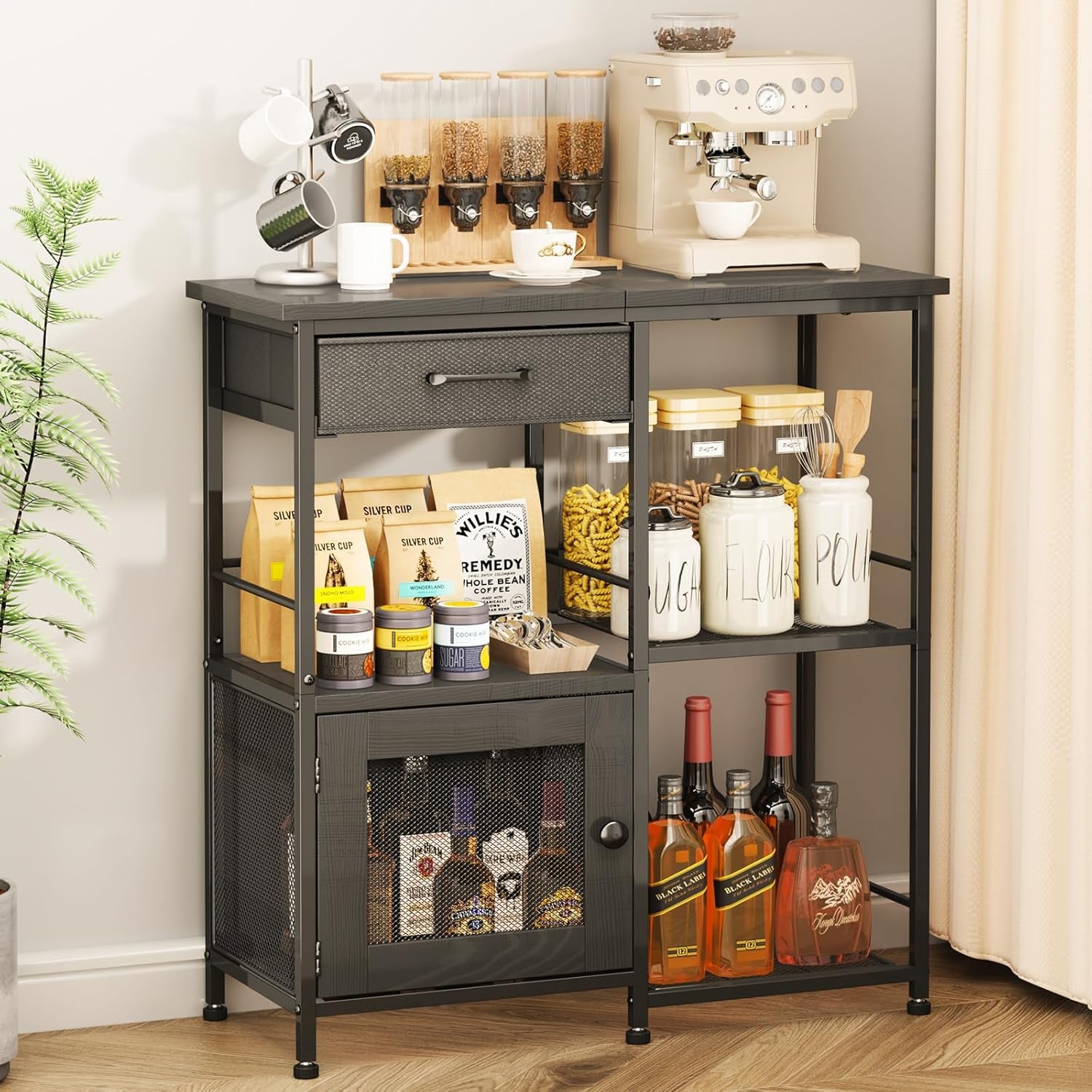 Black finish buffet with dark wood top, single drawer, mesh-front cabinet and open compartments staged with kitchen items