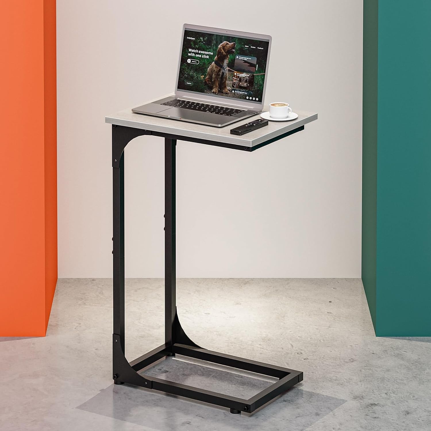 C-shaped side table with light gray waterproof top, slim black metal frame and laptop placed on top.