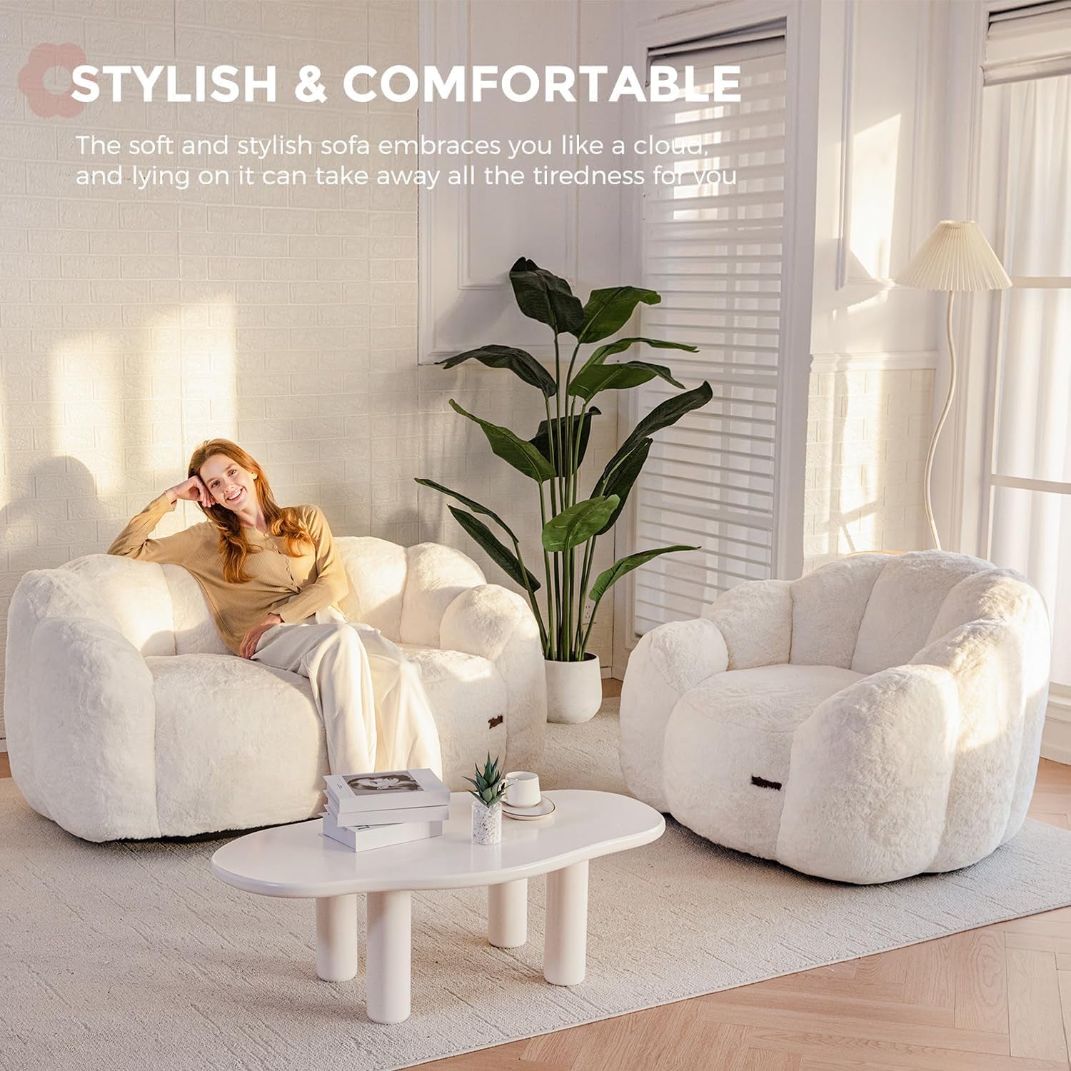Pairing of beige floral-shaped faux fur loveseat and single chair angled in a styled living room