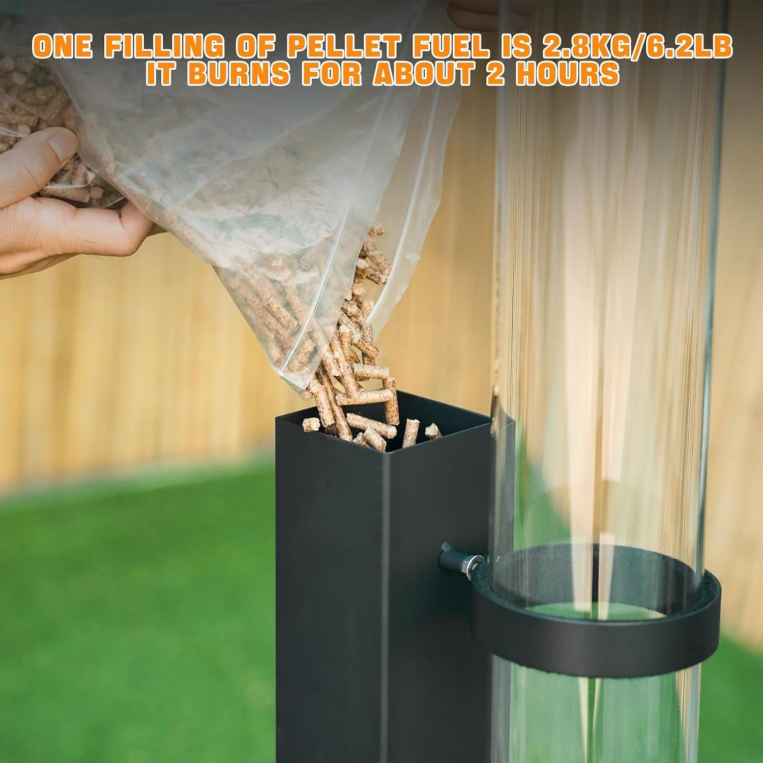 Close-up of hand pouring wood pellets into the black hopper beside the clear glass flame tube