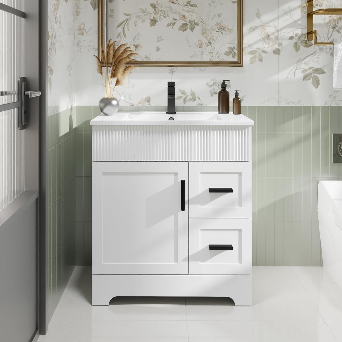 Front view of a single-sink white vanity with fluted upper front and black hardware