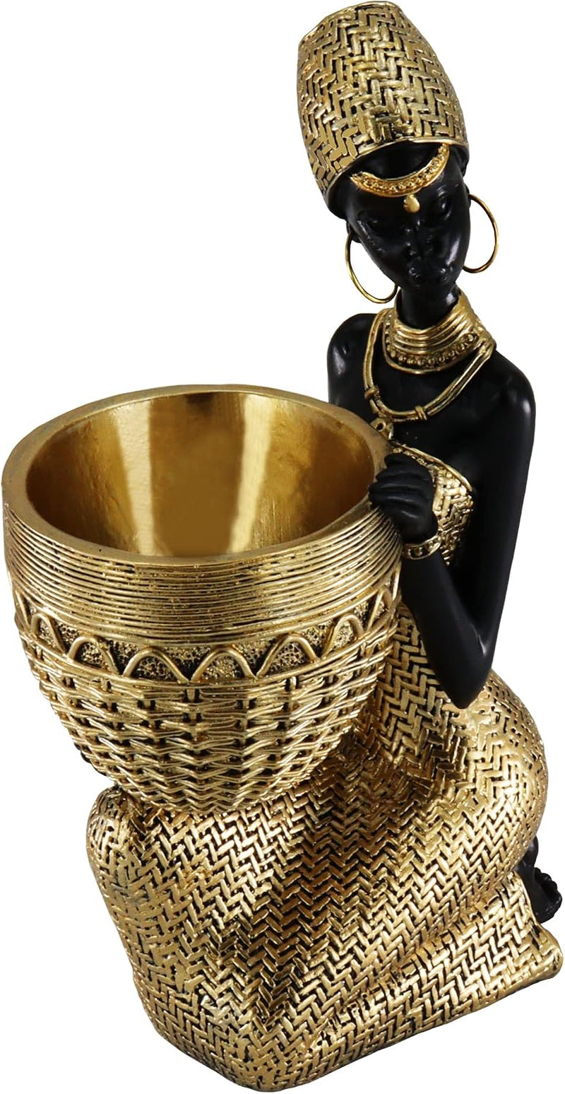Three-quarter view of the statue holding a woven-style bowl, showing gold textured dress and jewelry
