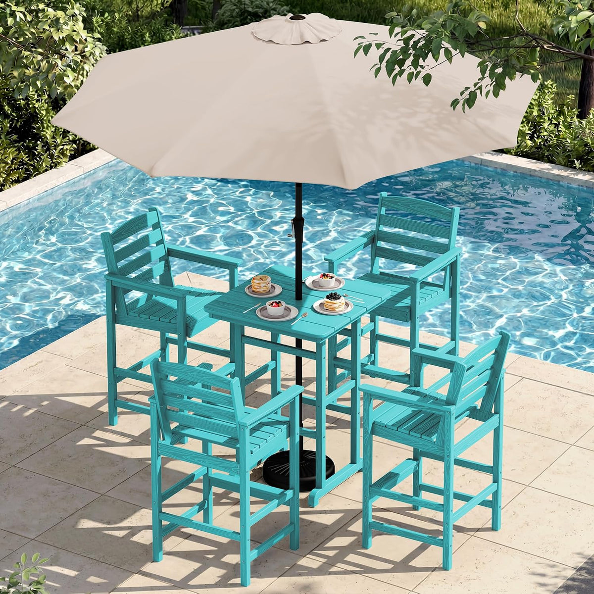 Overhead view of a turquoise four-chair bar set and table under a beige umbrella by the pool.