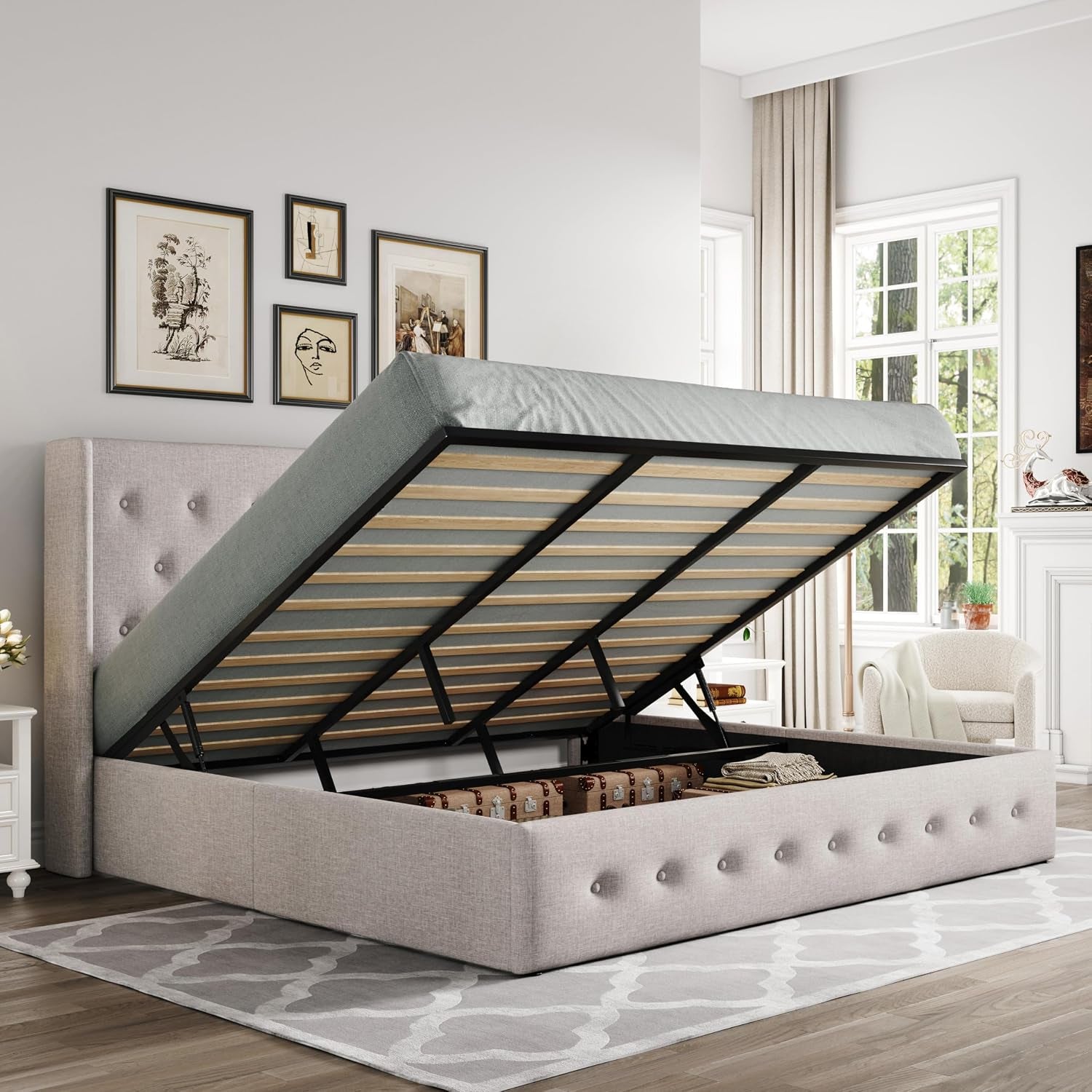 Light blush upholstered storage bed with raised mattress frame showing internal storage and tufted footboard.