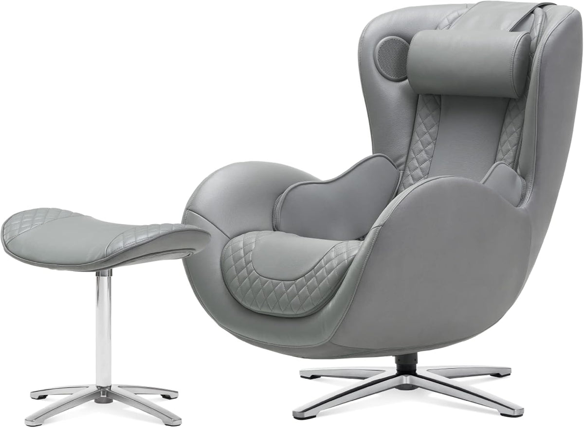 Light gray full-body massage chair with quilted seat panels and matching ottoman on chrome bases.