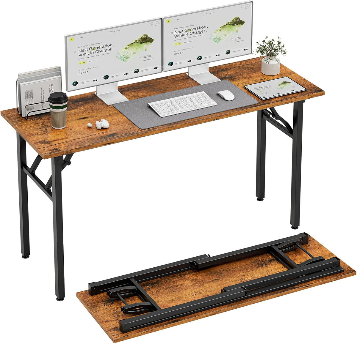 Rustic brown wood desk top with dual monitors, keyboard mat and a folded tabletop and legs positioned at the bottom.