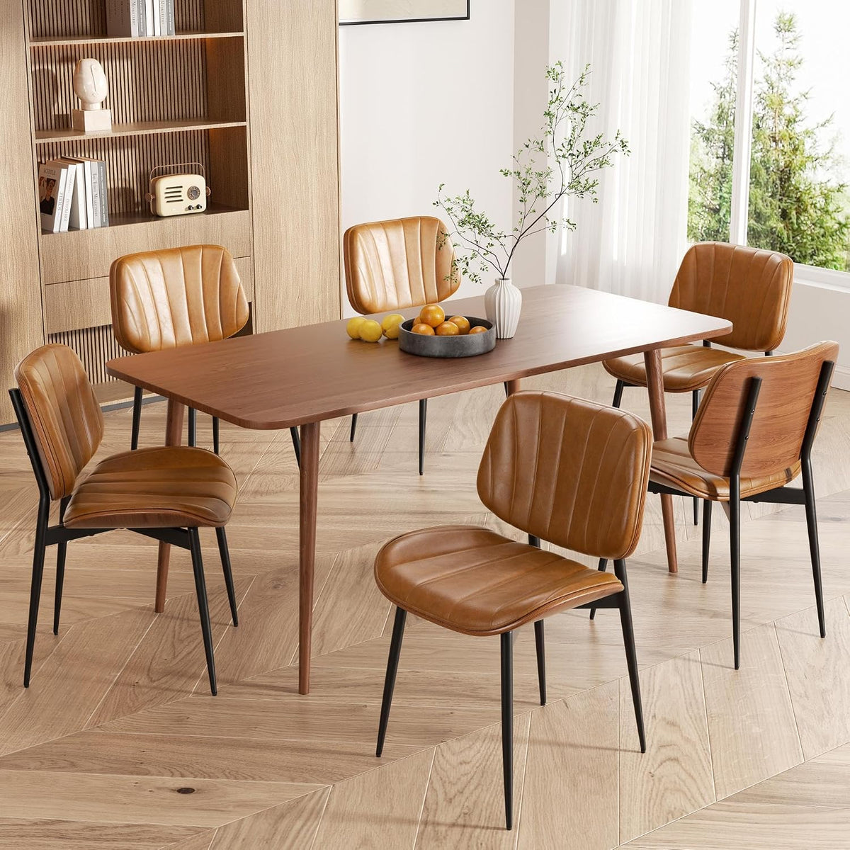 Dining scene with tan faux-leather chairs showing stitched vertical channels.