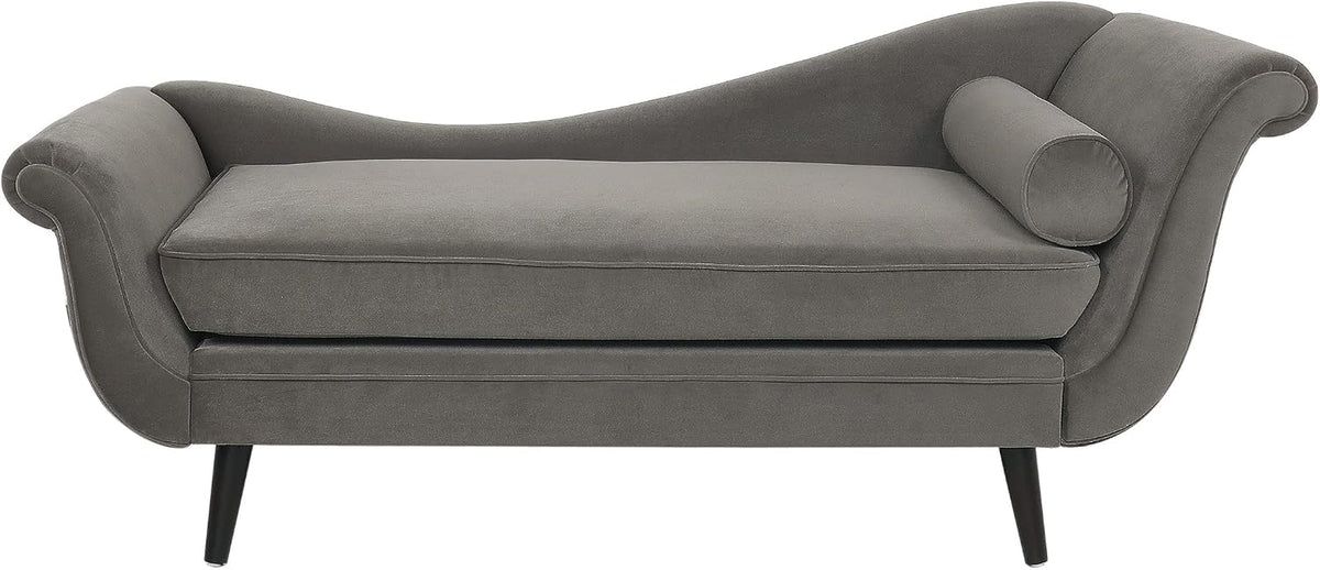 Front view of a gray velvet chaise lounge with rolled armrests, bolster pillow and black tapered legs.