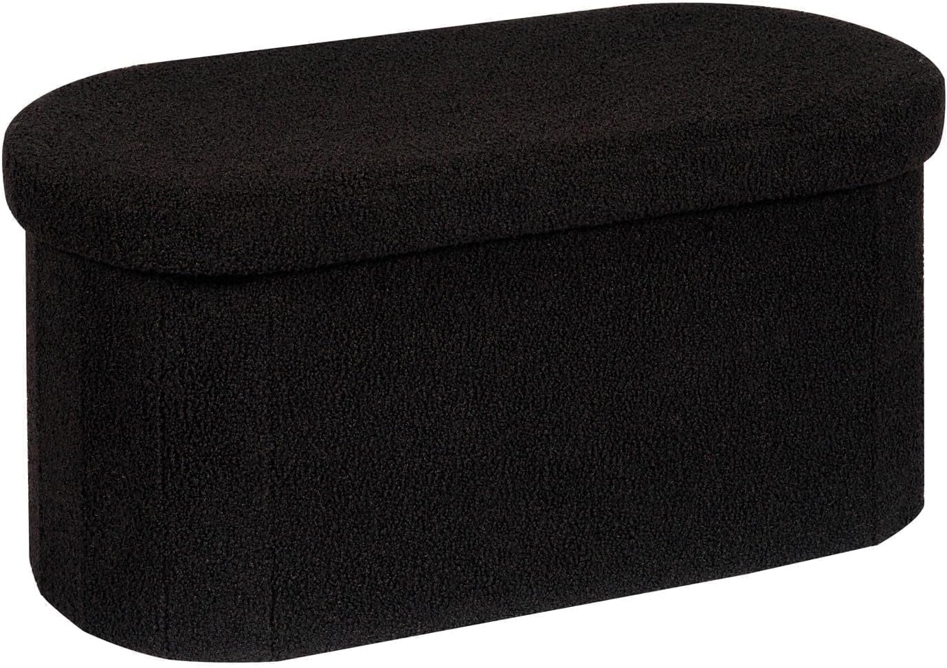 Oval storage ottoman covered in black sherpa fabric, angled to show rounded lid