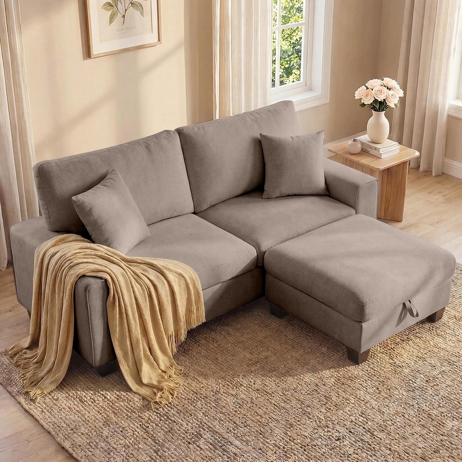 Three-quarter view of the loveseat paired with a matching ottoman placed as a chaise, throw draped over arm.